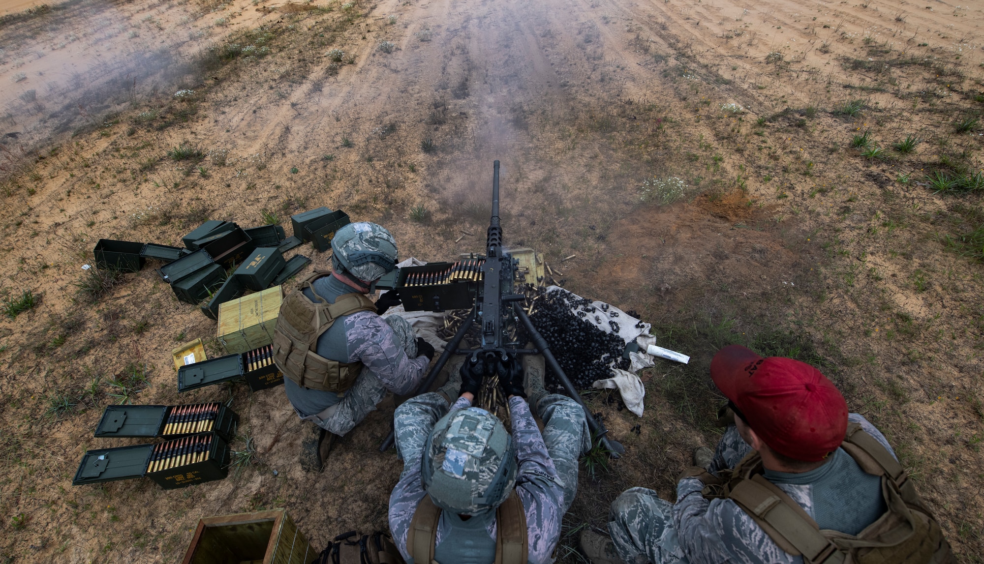 Airmen fire a Browning M2 machine gun