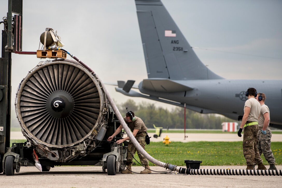 Airmen from the 121st Maintenance Group prepare a CFM-56 turbofan engine for shipment