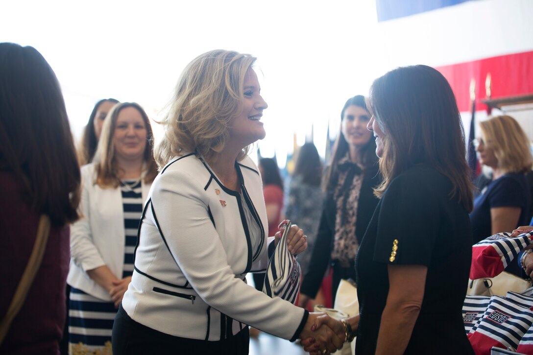 Mrs. Rebecca Cederholm, the U.S. Marine Corps Forces Command Deputy Commander’s wife, receives a care package from Second Lady of the United States Karen Pence during a town hall event honoring active-duty spouses at Naval Station Norfolk, Norfolk, Virginia, April 24, 2019. The town hall was held to honor military spouses and children of deployed or deploying service members. During her visit, Second Lady Pence delivered care packages, spoke with spouses, and highlighted the programs and services that military service organizations such as the USO provide. (U.S. Marine Corps photo by Sgt. Jessika Braden/released