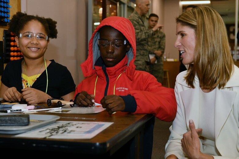 U.S. Rep. Lori Trahan speaks with Lavredana Deka, left, and Denzel Kisekka, of Rogers STEM Academy in Lowell, Mass., during a visit to the STARBASE Academy at Hanscom Air Force Base, Mass., April 25.