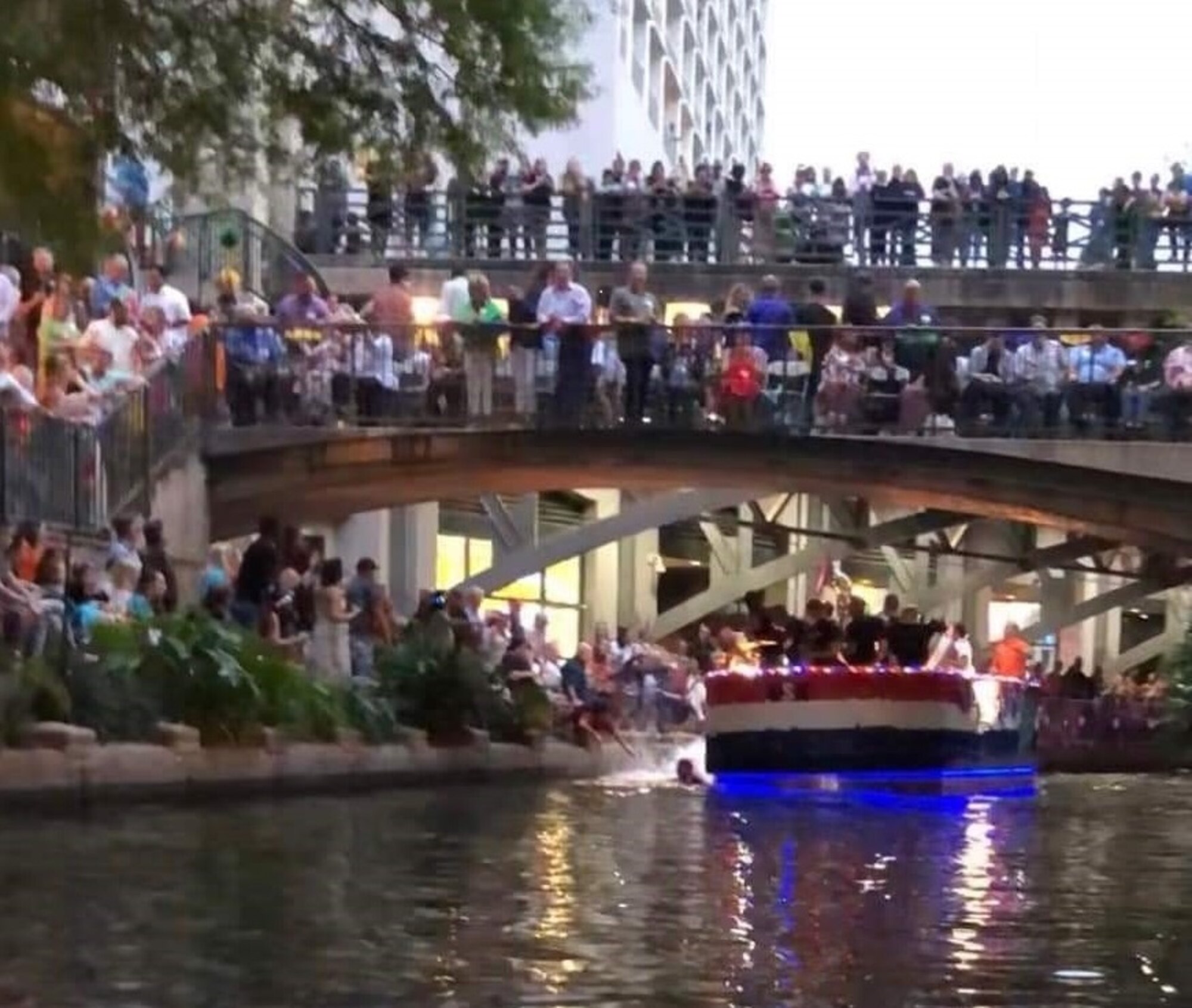 After he jumped off his barge, Tech Sgt. Ryan Fillweber races to save a woman who had fallen into the San Antonio River during the April 22 Texas Cavaliers River Parade. Fillweber is a military ambassador during the 2019 Fiesta San Antonio celebrations, which last from April 18 to April 28 and celebrate a variety of historic and cultural events across the city.