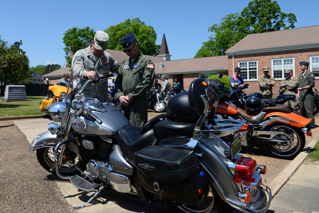 Col. Gary Hayward, 14th Mission Support Group commander, and Chaplain (Maj.) Bradley Kimble, 14th Flying Training Wing deputy chaplain, pray together during the Blessing of the Bikes April 24, 2019, on Columbus Air Force Base, Miss. The event is a tradition that is held in the military as well as the civilian world, in which motorcycle riders can be blessed in the hope it will bring safety for future travels. Motorcyclists from all ranks and units came to the chapel to be a part of the blessing and eat lunch with other like-minded people. (U.S. Air Force photo by Airman 1st Class Jake Jacobsen)