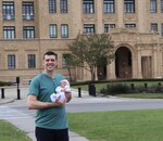 Air Force Capt. (Dr.) Andy Murtha holds baby Claire in front of the old Brooke Army Medical Center building at Joint Base San Antonio-Fort Sam Houston April 6, 2019. Murtha and his daughter share the legacy of being born at BAMC.