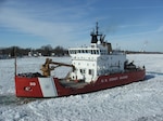 The Coast Guard Cutter Mackinaw, a 240-foot heavy icebreaker, breaks ice near Marine City, Mich., along the St. Clair River, Jan. 28, 2015. The cutter was operating as part of Operation Taconite, which is the ice breaking operation for the northern Great Lakes.