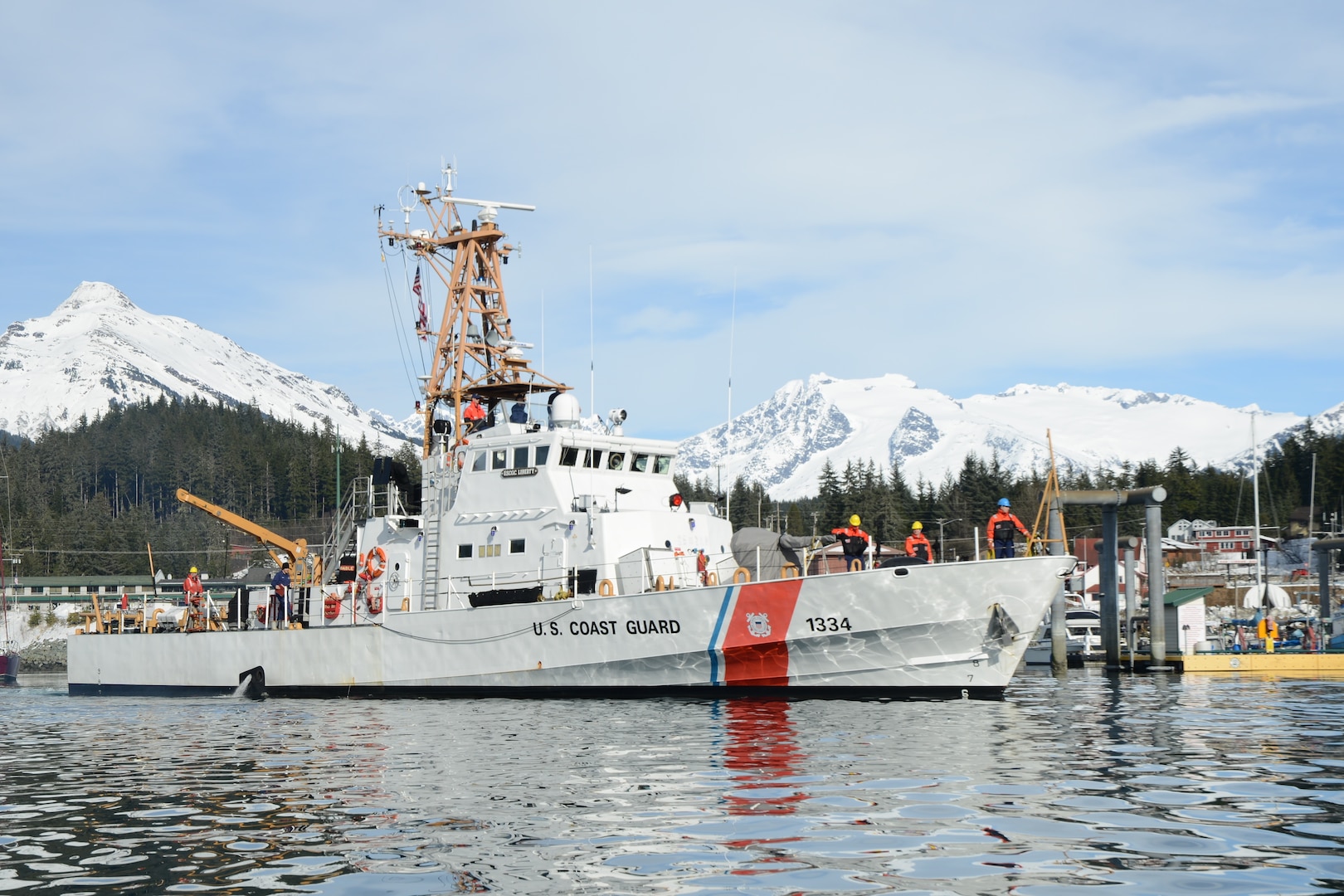The crew of the Coast Guard Cutter Liberty prepares to moor at their homeport of Juneau, Alaska, March 13, 2018. The crew of the Cutter Liberty, a 110-foot patrol boat homeported in Juneau, Alaska, was completing tailored ship's training availability, a biennial readiness assessment of the cutter and crew.