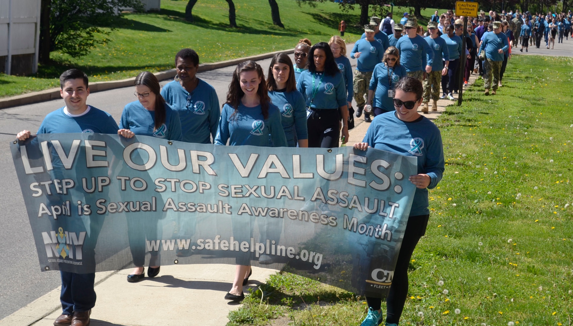 Supporters of Sexual Assault Awareness and Prevention Month from NSA Philadelphia and its tenant commands, including DLA Troop Support, create a "sea of teal" on their annual awareness walk across the installation April 23, 2019 in Philadelphia.