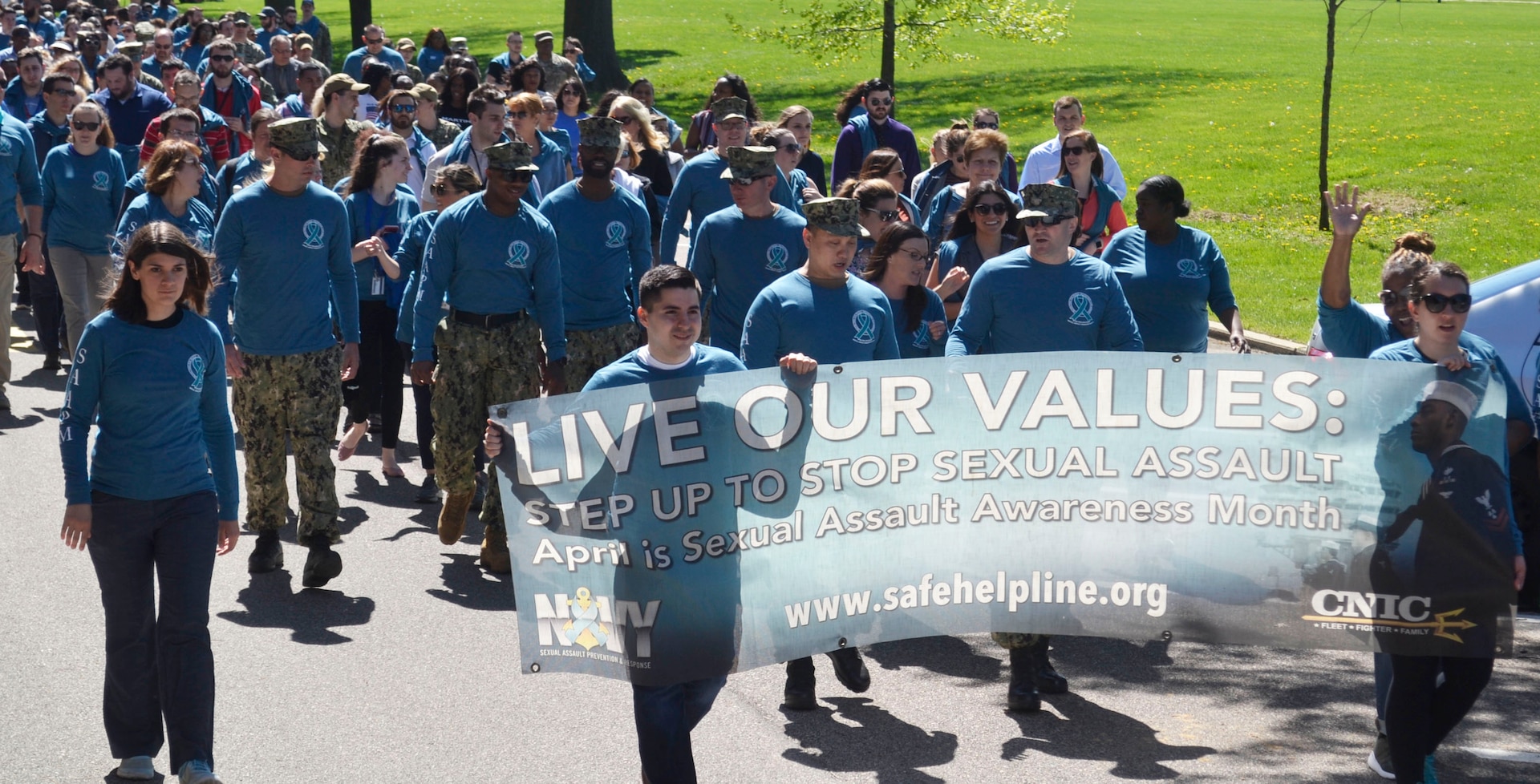 Supporters of Sexual Assault Awareness and Prevention Month from NSA Philadelphia and its tenant commands, including DLA Troop Support, create a "sea of teal" on their annual awareness walk across the installation April 23, 2019 in Philadelphia.