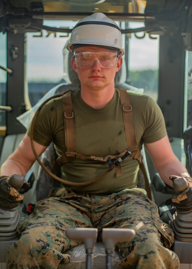 U.S. Marine Corps Lance Cpl. Chance R. Harmening, heavy equipment operator with Company C, 6th Engineer Support Battalion, 4th Marine Logistics Group, poses for a photo during the Innovative Readiness Training Camp Kamassa near Crystal Springs, Miss., on April 24, 2019. The purpose of the Department of Defense’s IRT program is to support the community by pairing military members with civil projects that benefit the community, and enables Marine Reserve units to increase their efficiency and performance. (U.S. Marine Corps photo by Lance Cpl. Jose Gonzalez)