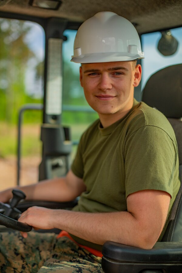U.S. Marine Corps Lance Cpl. Spenser R. Nelson, heavy equipment operator with Company C, 6th Engineer Support Battalion, 4th Marine Logistics Group, poses for a photo during the Innovative Readiness Training Camp Kamassa near Crystal Springs, Miss., on April 24, 2019. The purpose of the Department of Defense’s IRT program is to support the community by pairing military members with civil projects that benefit the community, and enables Marine Reserve units to increase their efficiency and performance. (U.S. Marine Corps photo by Lance Cpl. Jose Gonzalez)