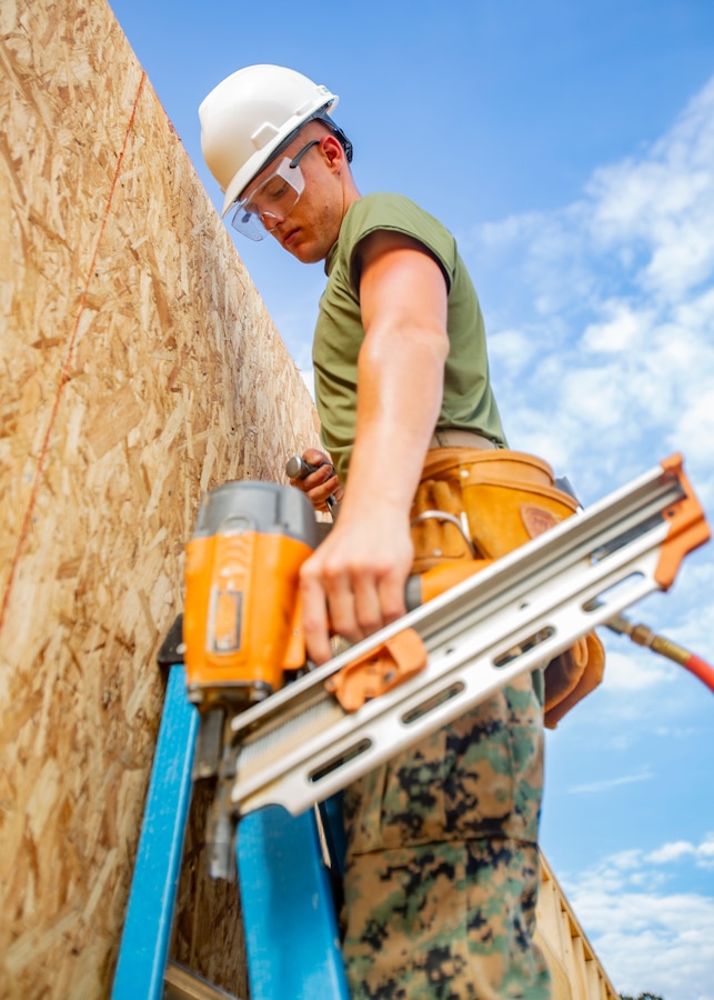 U.S. Marine Corps Lance Cpl. Logan R. Cayce, a combat engineer with Company C, 6th Engineer Support Battalion, 4th Marine Logistics Group, operates a nail gun during the Innovative Readiness Training Camp Kamassa near Crystal Springs, Miss., on April 24, 2019. The purpose of the Department of Defense’s IRT program is to support the community by pairing military members with civil projects that benefit the community, and enables Marine Reserve units to increase their efficiency and performance. (U.S. Marine Corps photo by Lance Cpl. Jose Gonzalez)