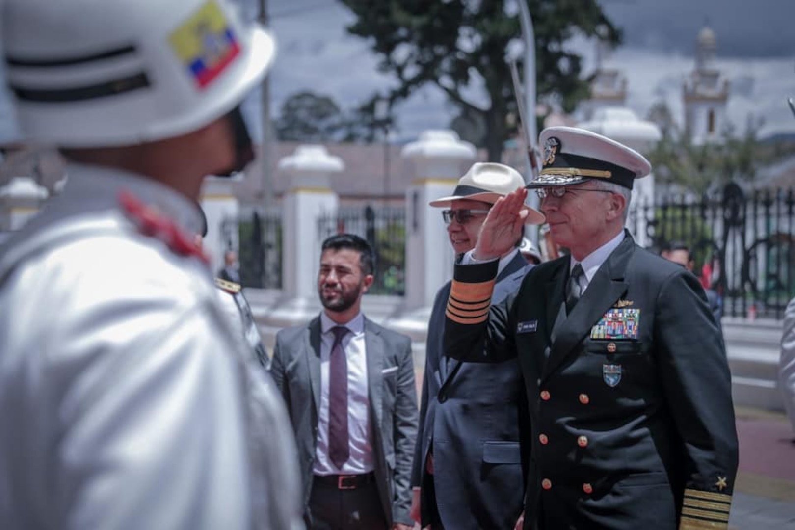 U.S. Navy Adm. Craig Faller, commander of U.S. Southern Command, renders honors upon arrival to meet with Ecuador's Minister of Defence, General Oswaldo Jarrín.