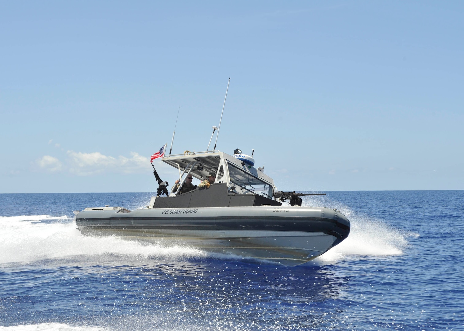 Coast Guardsmen from Port Security Unit 305 aboard a 32-foot Transportable Port Security Boat patrol a security zone off the coast of Guantanamo Bay, Cuba, Saturday, July, 15, 2017. Coast Guard PSUs serve as anti-terrorism force protection expeditionary units with boat crews and shore-side security teams capable of supporting port and waterway security anywhere the military operates.