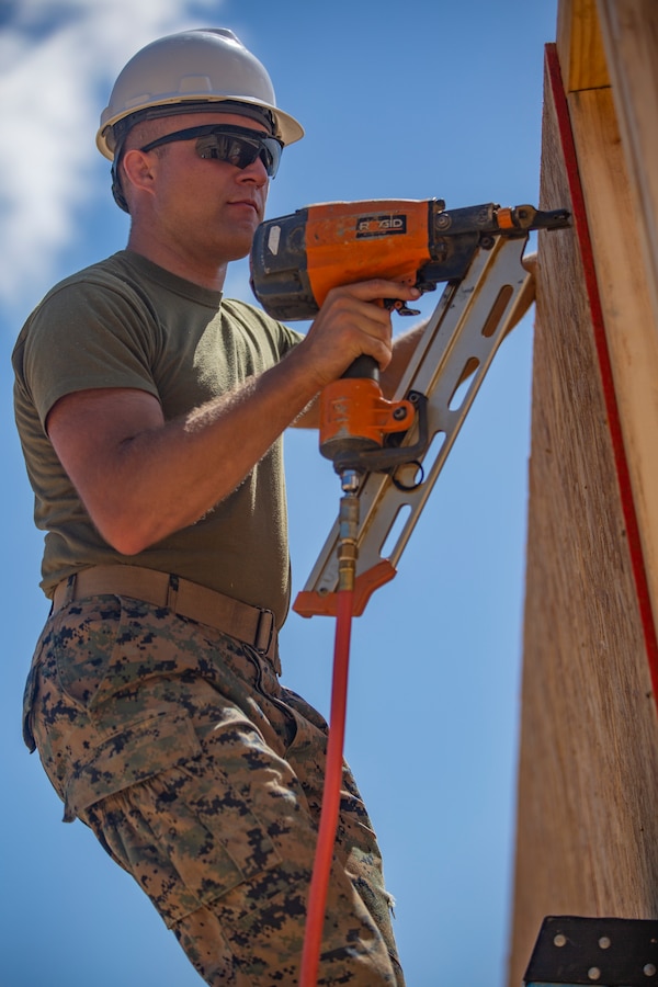 U.S. Marine Corps Cpl. Ryan M. Ginger, a fire team leader with 6th Engineer Support Battalion, 4th Marine Logistics Group, operates a nail gun during the Innovative Readiness Training Camp Kamassa near Crystal Springs, Miss., on April 24, 2019. The purpose of the Department of Defense’s IRT program is to support the community by pairing military members with civil projects that benefit the community, and enables Marine Reserve units to increase their efficiency and performance. (U.S. Marine Corps photo by Lance Cpl. Jose Gonzalez)