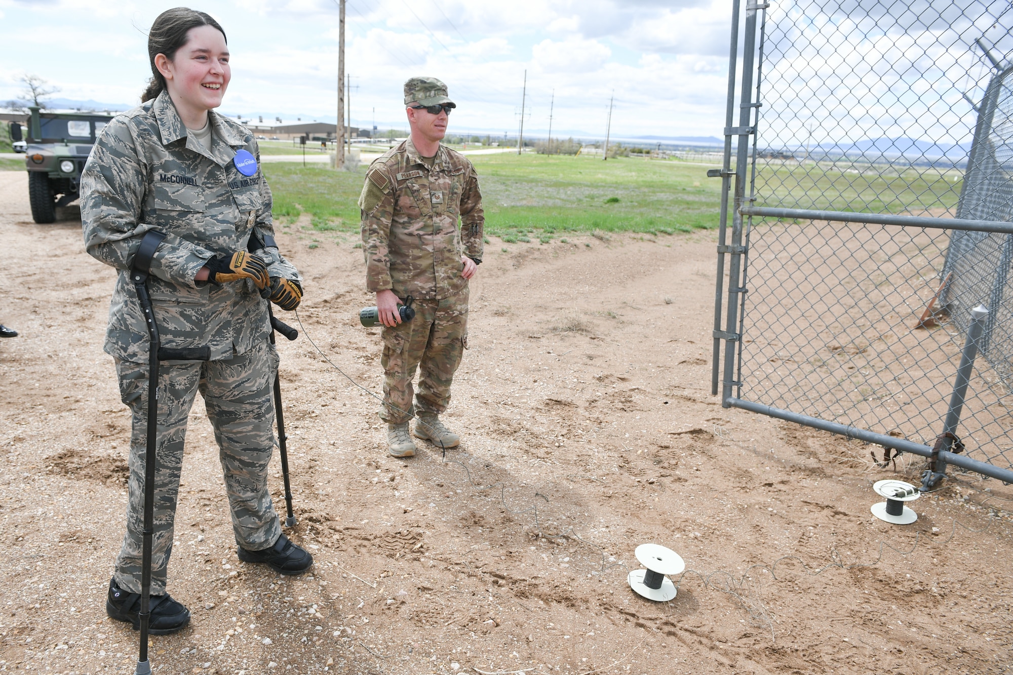 Michelle McConnell detonates controlled ordnance with Tech. Sgt. Peter Pearson, 775th Explosive Ordinance Disposal Flight , April 22, 2019, at Hill Air Force Base, Utah. Michelle was granted her wish to be Airman of the day by Make-A-Wish Utah and 75th Air Base Wing at Hill. (U.S. Air Force Photo by Cynthia Griggs)