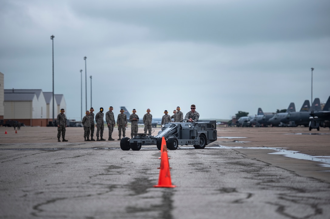 Tech. Sgt. Barry Lewis, 363rd Training Squadron munitions apprentice course instructor, drives an MHU-83 bomb lift truck at Sheppard Air Force Base, Texas, April 24, 2019. The students are learning how to use the MHU-83 and must navigate throuh multiple cones. Lewis goes first demonstrating to the students that the MHU-83 is capable of tight turns. (U.S. Air Force photo by Airman 1st Class Pedro Tenorio)