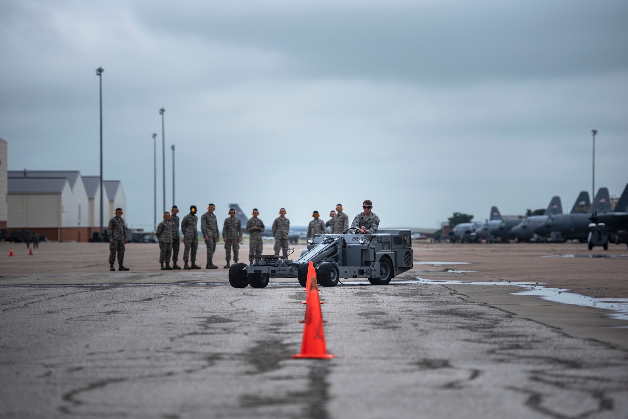 Tech. Sgt. Barry Lewis, 363rd Training Squadron munitions apprentice course instructor, drives an MHU-83 bomb lift truck at Sheppard Air Force Base, Texas, April 24, 2019. The students are learning how to use the MHU-83 and must navigate throuh multiple cones. Lewis goes first demonstrating to the students that the MHU-83 is capable of tight turns. (U.S. Air Force photo by Airman 1st Class Pedro Tenorio)