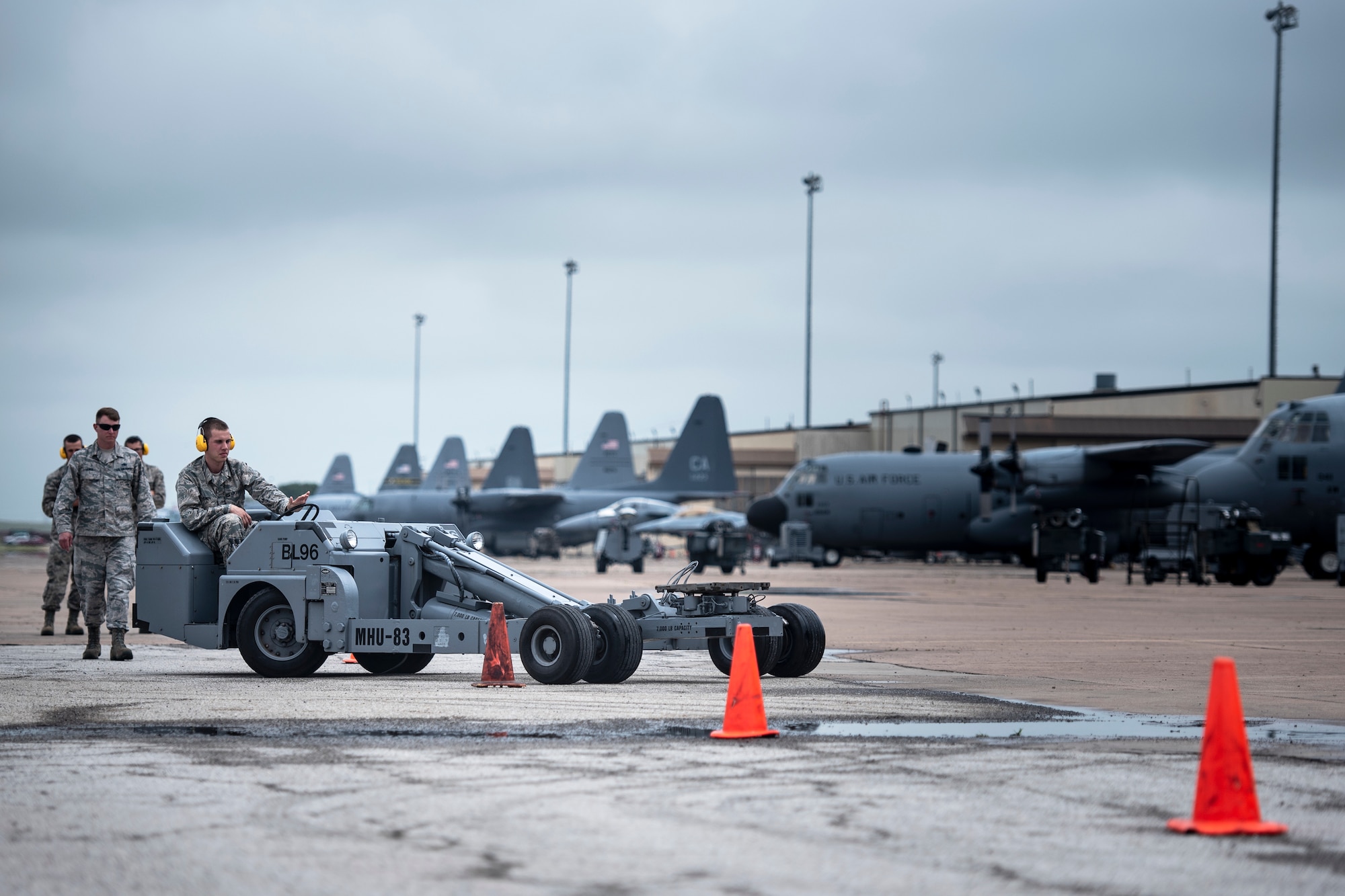 Airman Trevor King, 363rd Training Squadron munitions apprentice course student, drives an MHU-83 bomb lift truck through a cone obstacle course at Sheppard Air Force Base, Texas, April 24, 2019. King and his classmates are on block three of their training and this is the first time they are touching an MHU-83. The students will drive the MHU-83 for around seven hours of training before using the bomb lift truck as intended, to lift and load bombs. (U.S. Air Force photo by Airman 1st Class Pedro Tenorio)