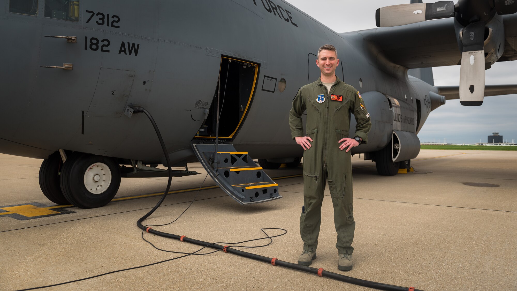 Airman posing with aircraft.