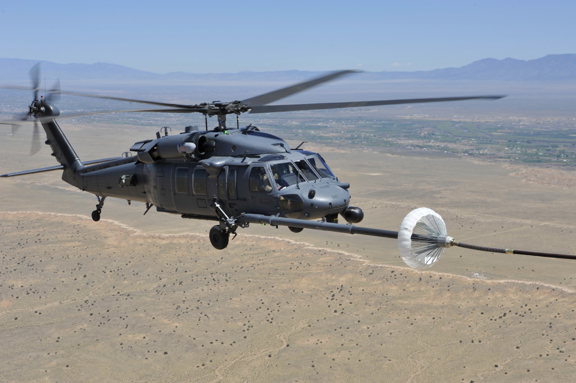 An HH-60G PAVE Hawk helicopter assigned to the 512th Rescue Squadron, Kirtland Air Force Base, N.M., refuels during a training mission over New Mexico, April 19, 2019. The Mission of the 512th RQS is to provide mission-ready UH-1N Huey and HH-60G Pave Hawk special operations and combat rescue aircrew to operational units world-wide. (U.S. Air Force photo by Staff Sgt. Dylan Nuckolls/Released)