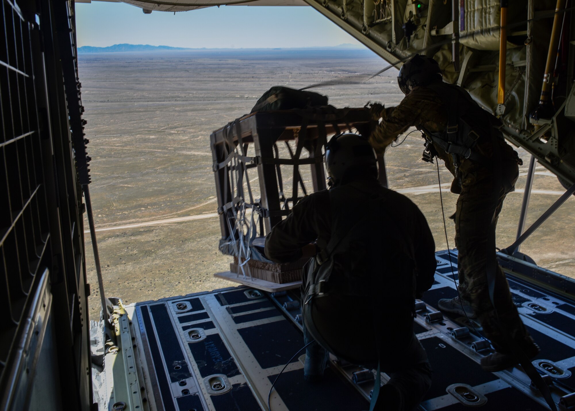 U.S. Air Force loadmasters with the 415th Special Operations Squadron conduct an airdrop at Kirtland Air Force Base, N.M. April 19, 2019. The 415th SOS mission is to train special operations aircrew members for the MC-130J Commando II and HC-130J Combat King II. (U.S. Air Force photo by Airman 1st Class Austin J. Prisbrey)