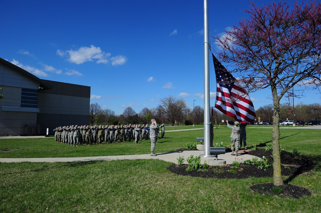 Members of the Geospatial and Signatures Intelligence Group flag detail capture the U.S. flag as it is lowered during a retreat ceremony at the National Air and Space Intelligence Center on April 15. The retreat took place eleven years after a transformation ceremony formally activating NASIC’s four groups and seventeen squadrons. (U.S. Air Force photo by Senior Airman Michael Hunsaker)