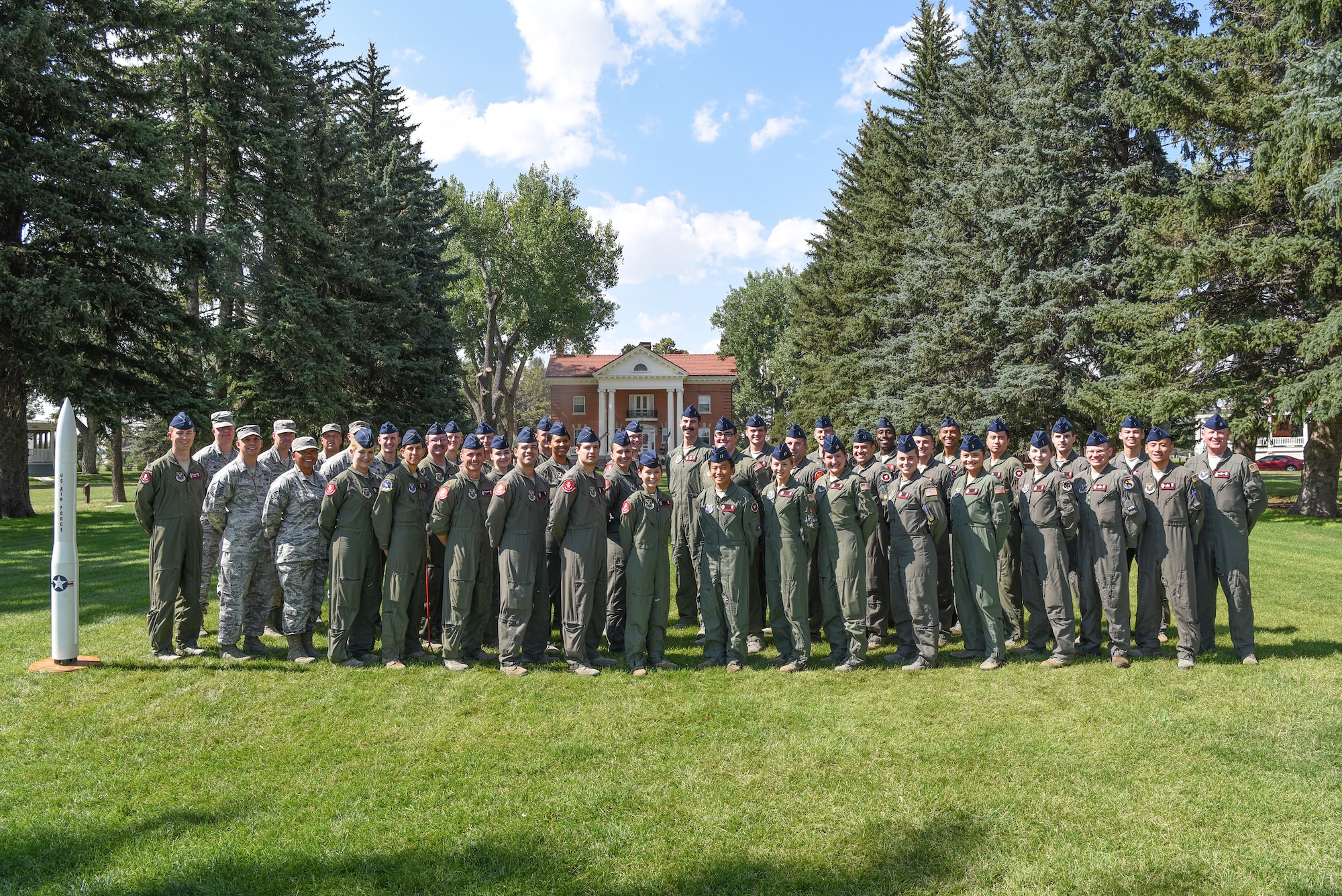 The 320th Missile Squadron stands for a group photo August 8, 2018, on F.E. Warren Air Force Base, Wyo. The 320th MS was named the General Samuel C. Phillips overall best Missile Squadron for 2018, by Air Force Global Strike Command, the Phillips awards has made its way to the 320th five time since it was created in 1994. (U.S. Air Force photo by Senior Airman Abbigayle Williams)