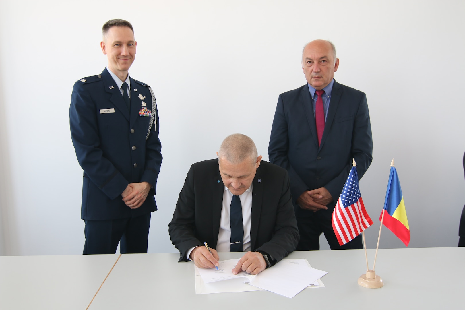 Dr. Phys. Marius-Ion Piso (center), President of Romanian Space Agency (ROSA), signs the United States-Romania Space Situational Awareness (SSA) agreement alongside Lt. Col. Matthew Kimsal (left), representative of the U.S. Embassy in Romania, and Mircea Cernat, Senior Engineer of ROSA, at ROSA headquarter in Bucharest, Romania, on April 25, 2019. The U.S. government partners with space-faring entities to promote the responsible, peaceful and safe use of space. SSA sharing agreements lay the foundation that allows USSTRATCOM to share information with allies and partners in support of launches, on-orbit maneuvers, anomaly resolution, de-commissioning activities and on-orbit conjunction assessments. SSA sharing is a foundational capability that affects all future space operations and projects.