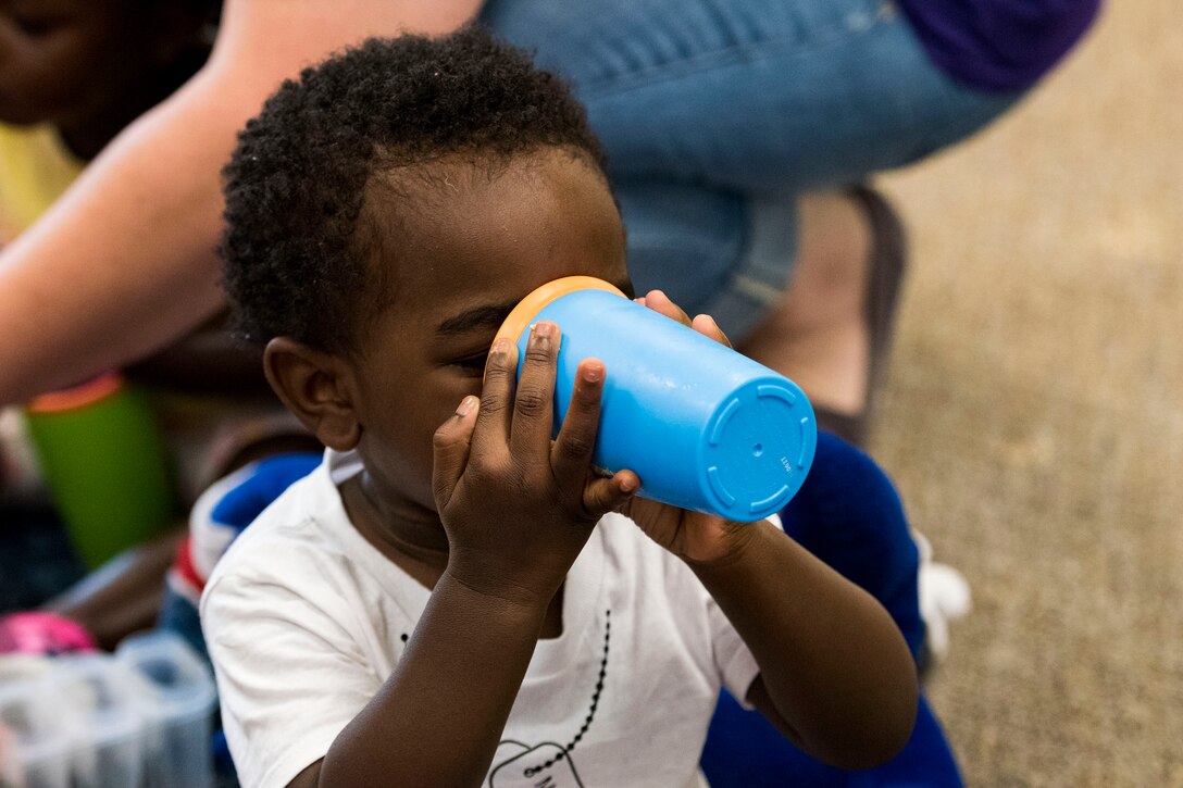 A child drinks some milk during the Teddy Bear Picnic, April 26, 2019, at Moody Air Force Base, Ga. The Child Development Center hosted the event in support of the Month of the Military Child in April. (U.S. Air Force photo by Senior Airman Erick Requadt)