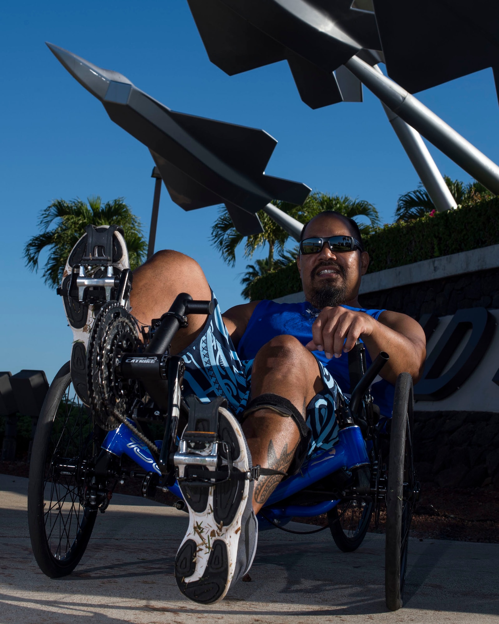 Retired Chief Master Sgt. Garrett Kuwada, originally from Honolulu, Hawaii, poses with his recumbent bike, which is one of the sports he will be participating in during the 2019 Wounded Warrior Games. Kuwada had a ruptured brain aneurysm resulting in blood around his brain and damage to his spinal cord and legs. He now suffers loss of coordination and balance, hearing, vision, speech and cognitive function. (U.S. Air Force photo by Tech. Sgt. Heather Redman)