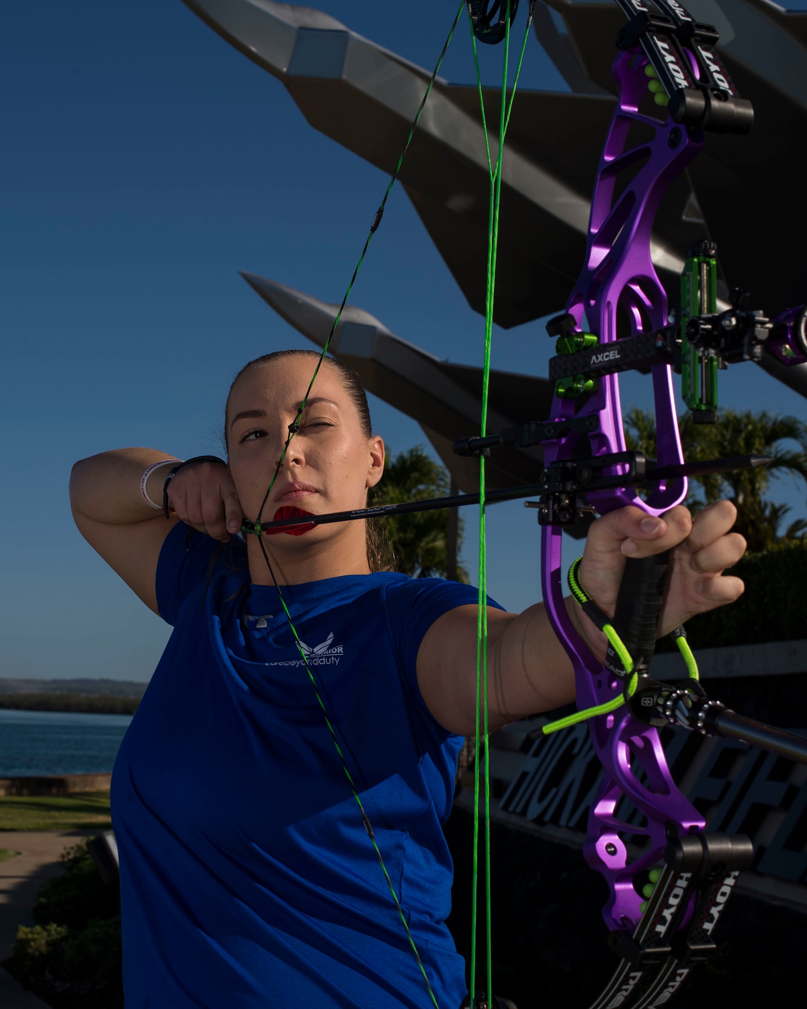 Senior Airman Faith Donato, 647th Security Forces Squadron, poses with her bow and arrow. Donato will serve as an alternate at the 2019 Wounded Warrior Games held this summer in Tampa, Florida. (U.S. Air Force photo by Tech. Sgt. Heather Redman)