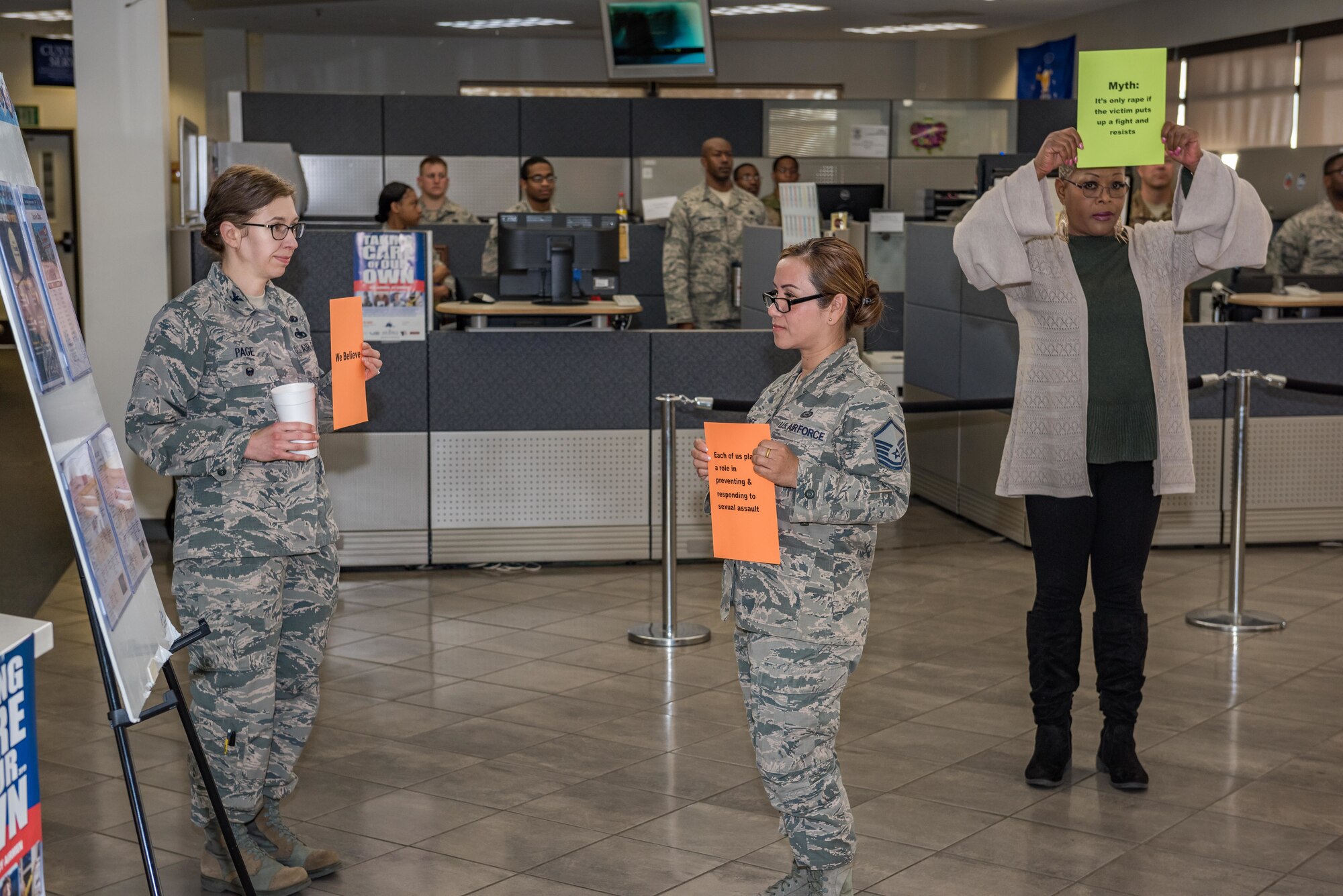 Team Edwards members participate in a Sexual Assault Awareness and Prevention Month Freeze Flash Mob at Edwards Air Force Base, California, April 16. Team Edwards members staged the freeze mobs at certain locations around the base and held signs regarding facts about sexual assault. (U.S. Air Force photo by Matt Williams)