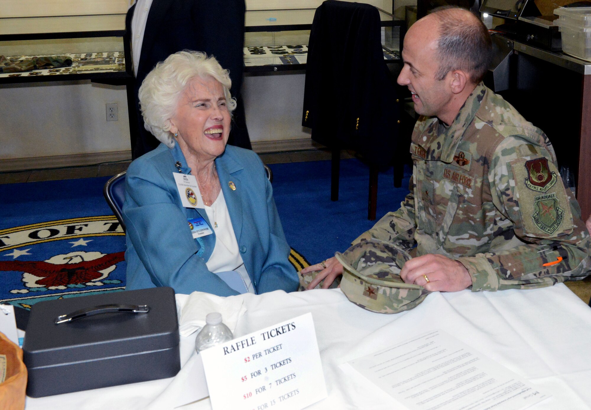Civ-Mil member and past president Aida O'Connor talks with 412th Test Wing Commander Brig. Gen. E. John Teichert during the annual Civ-Mil mixer at Edwards Air Force Base, Calif., April 25. O’Connor created the Edwards Civ-Mil support group more than two decades ago and remains active in the organization as a board member. (U.S. Air Force photo by Michelle Thomas)