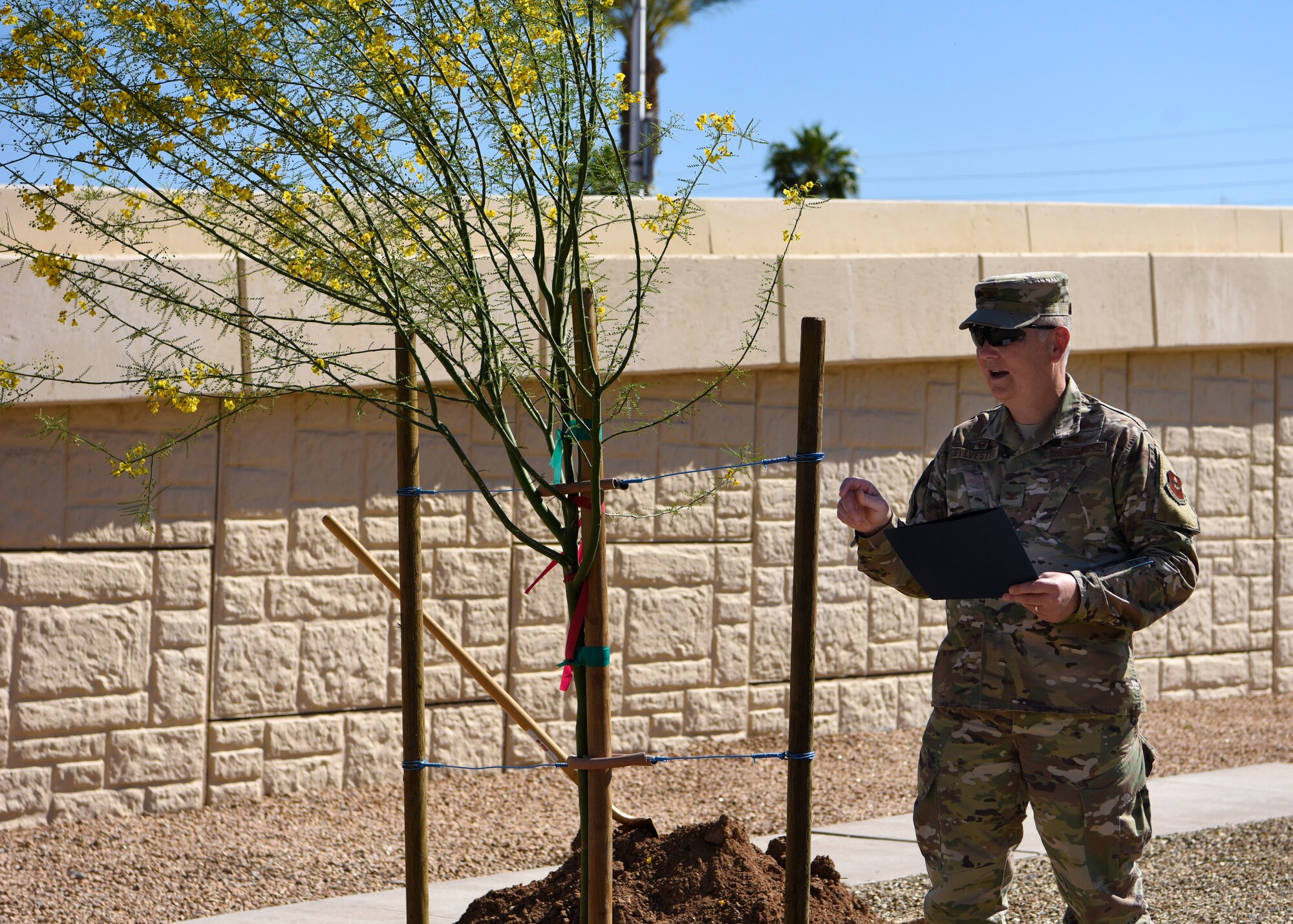 Col. Robert Sylvester, 56th Mission Support Group commander, reads the Arbor Day proclamation April 26, 2019, at Luke Air Force Base, Ariz. The 56th MSG and 56th Civil Engineering Squadron, along with a group of Thunderbolts, teamed up to celebrate trees and nature. (U.S. Air Force photo by Airman 1st Class Zoie Cox)