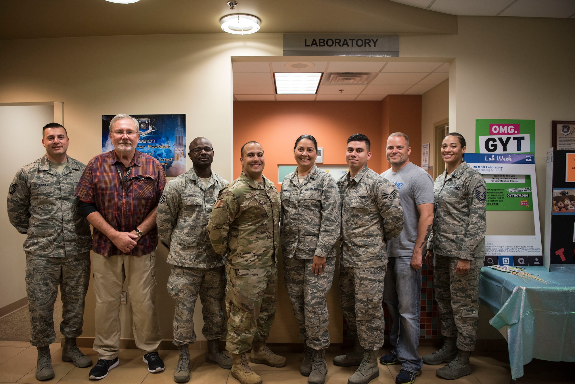 Members assigned to the 30th Medical Support Squadron Laboratory pose for a photo in celebration of Medical Laboratory Professionals Week, also known as Labe Week, April 24, 2019, Vandenberg Air Force Base, Calif. Lab Week is an annual observance to spread awareness and show appreciation to medical laboratory professionals and pathologists for the work they do to assist patients. (U.S. Air Force photo by Airman 1st Class Hanah Abercrombie)