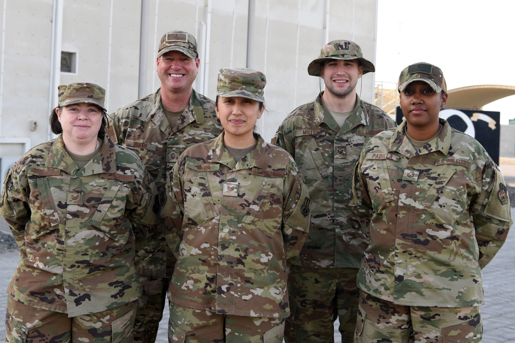 380th Air Expeditionary Wing Command Post personnel pose for a group photo April 25, 2019, Al Dhafra Air Base, United Arab Emirates.