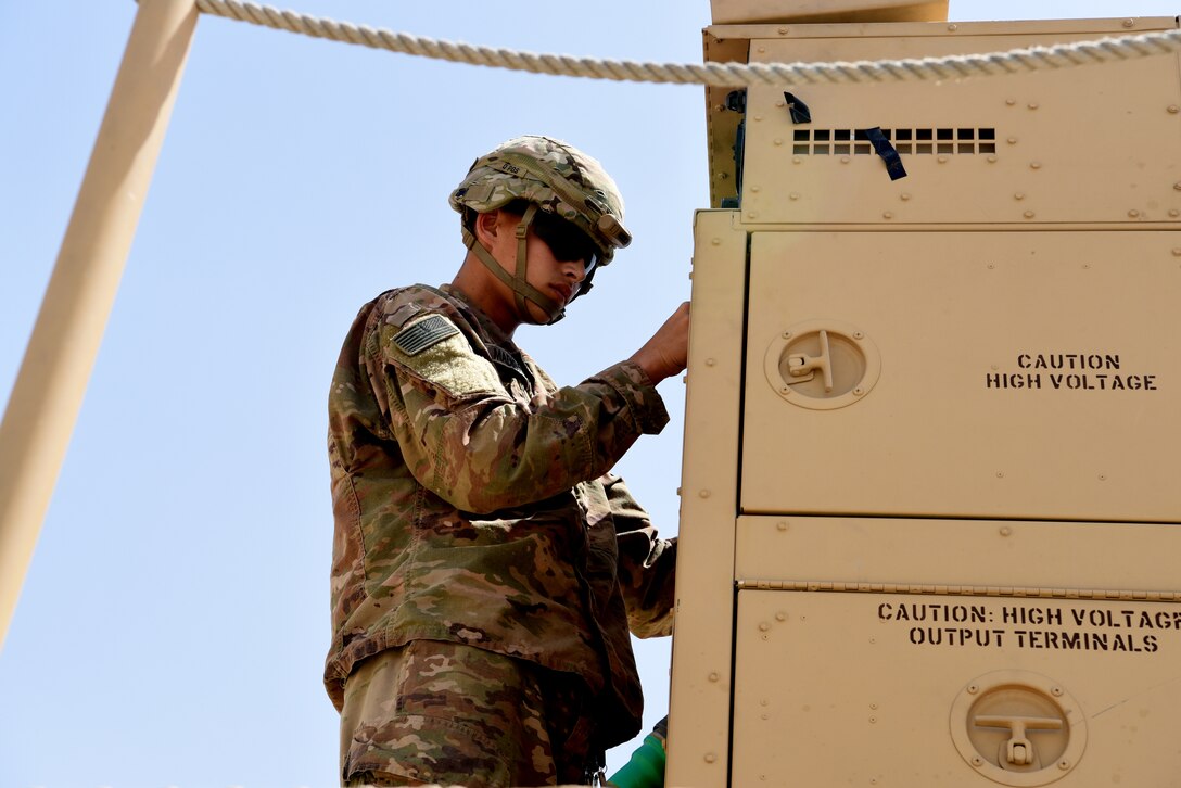Private 2nd Class Brian Madigan, Bravo Battery, 1st Battalion, 43rd Air Defense Artillery Regiment, performs a system validation on a Patriot launcher April 24, 2019, on Al Dhafra Air Base, United Arab Emirates.