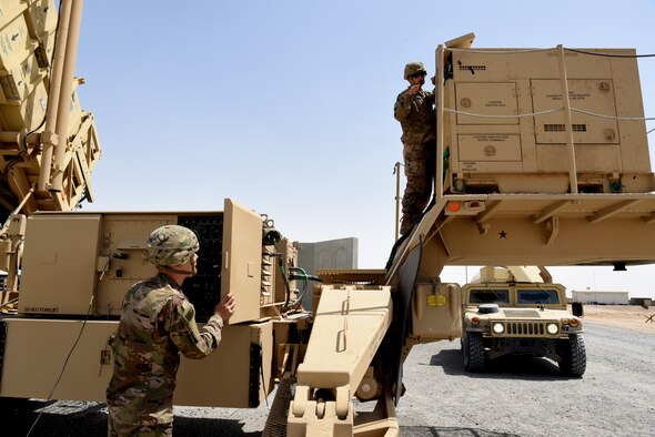 Aaron Albin (left) and Brian Madigan (right), both Private 2nd Class with Bravo Battery, 1st Battalion, 43rd Air Defense Artillery Regiment, perform a system validation on a Patriot launcher April 24, 2019, on Al Dhafra Air Base, United Arab Emirates.