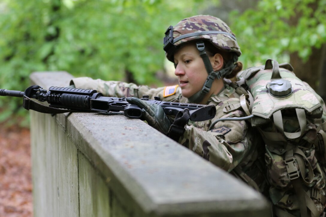 U.S. Army Reserve Spc. Kathryn Hubble, a combat medic healthcare specialis with the 209th Digital Liaison Detachment, 7th Mission Support Command (MSC), Wiesbaden, Germany, tackles the low wall while maneuvering the obstacle course during the 7th MSC Best Warrior Competition (BWC) in Kaiserslautern, Germany, April 26, 2019. BWC is an annual event designed to test the physical fitness, military knowledge, marksmanship, endurance and land navigational skills of each competitor. (U.S. Army Reserve photo by Sgt. Christopher Stelter, 221st Public Affairs Detachment)