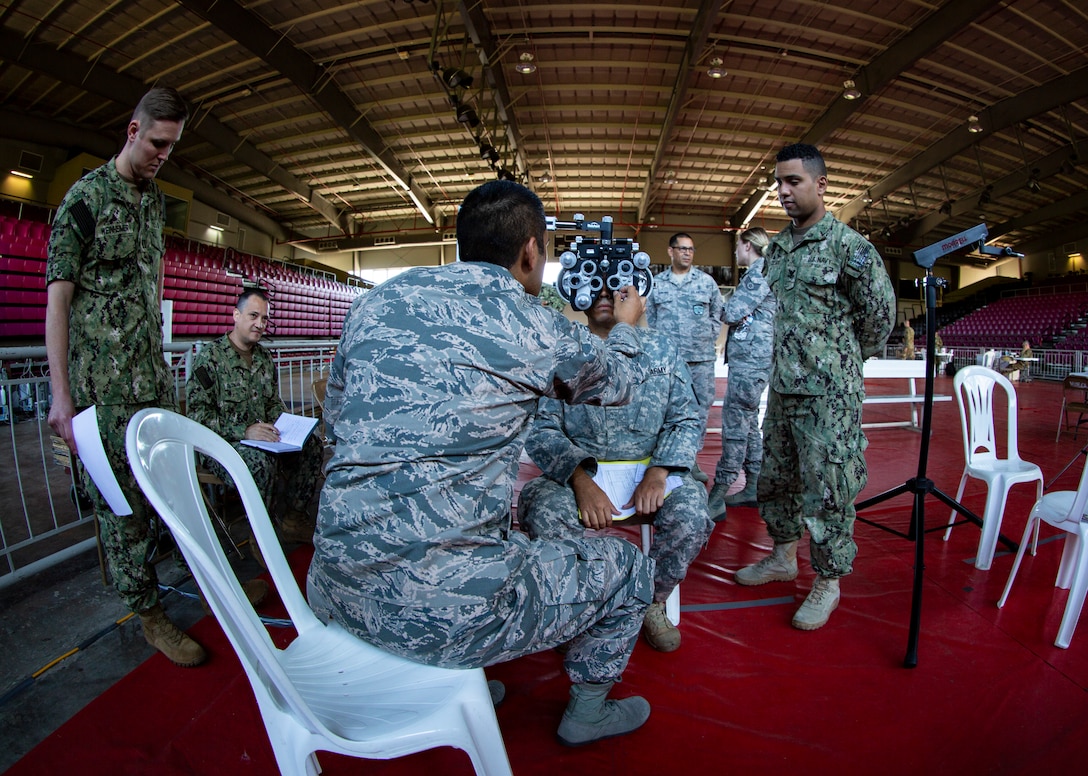 Service members practice the procedures of receiving patients at the optometry station at Ponce, Puerto Rico, April 26, 2019, during Innovative Readiness Training Puerto Rico. Marine Forces Reserve Sailors are working jointly with several National Guard and Reserve units from across the nation to provide medical care in Puerto Rico during a two-week medical exercise.