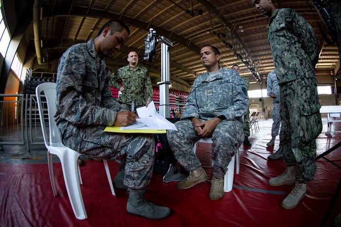 Service members practice the procedures of receiving patients at the optometry station at Ponce, Puerto Rico, April 26, 2019, during Innovative Readiness Training Puerto Rico. Marine Forces Reserve Sailors are working jointly with several National Guard and Reserve units from across the nation to provide medical care in Puerto Rico during a two-week medical exercise.