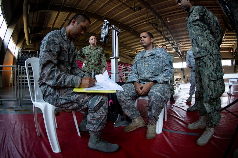 Service members practice the procedures of receiving patients at the optometry station at Ponce, Puerto Rico, April 26, 2019, during Innovative Readiness Training Puerto Rico. Marine Forces Reserve Sailors are working jointly with several National Guard and Reserve units from across the nation to provide medical care in Puerto Rico during a two-week medical exercise.