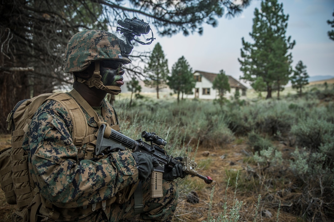 Marine Corps Mountain Warfare Training Center Bridgeport, CA – Seaman Roy Wells, a hospital corpsman with India Company, 3rd Battalion, 5th Marine Regiment, 1st Marine Division, holds position during a hike during Mountain Training Exercise 4-18 aboard Mountain Warfare Training Center Bridgeport, Calif., July 30, 2018. MWTC Bridgeport provides units a unique training experience by allowing the Marines to train in a mountainous environment and at high altitudes.