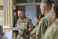 Chief Warrant Officer 3 Kim Ralston, 184th Sustainment Command, briefs members of the 1st Theater Sustainment Command’s Syrian Logistics Cell in Erbil, Iraq, April 24, 2019.