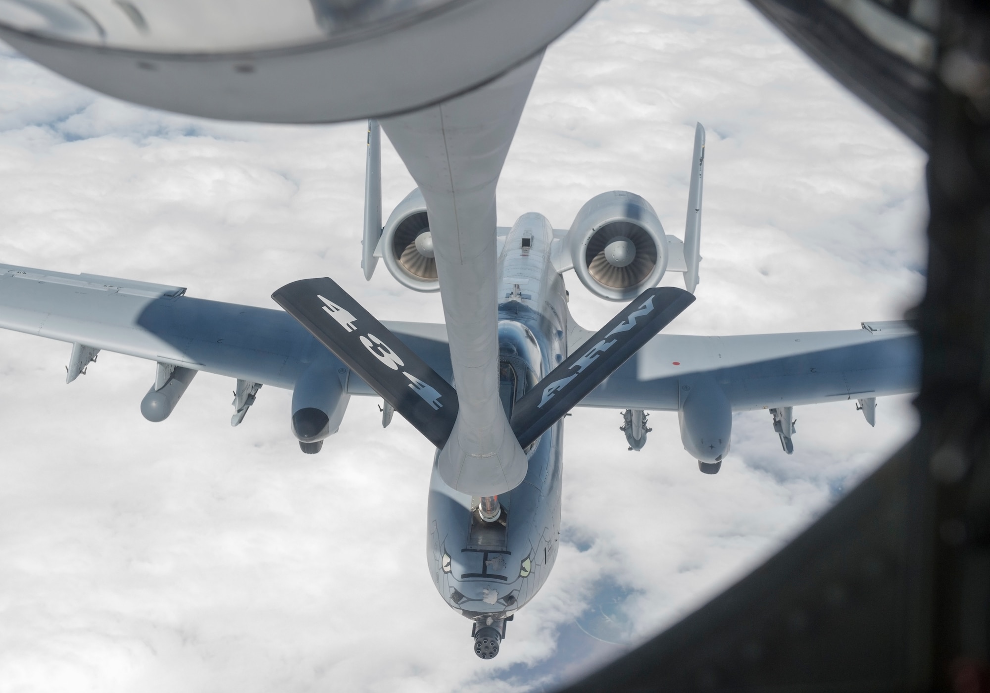 A 72nd Air Refueling Squadron inflight refueling technician, refuels an A-10 Warthog from the 122nd Fighter Wing, Fort Wayne, Ind., over the Midwest April 26, 2019. Forty-two employers, nominated by Guard and Reserve members from the 434th ARW, the 122th Fighter Wing in Fort Wayne, Ind., and the 181st Intelligence Wing in Terre Haute Ind., had a hands-on tour of the base that concluded with an air refueling mission. (U.S. Air Force photo/Tech Sgt. Jami K. Lancette)