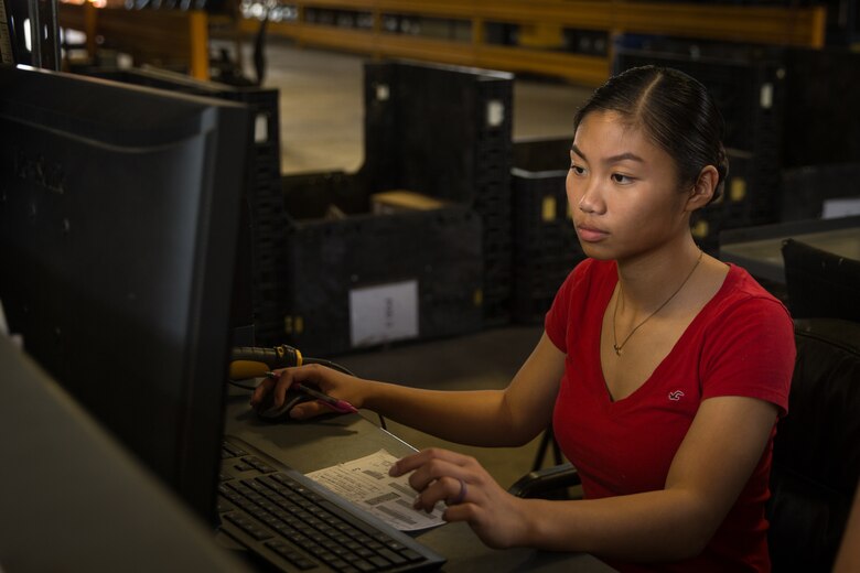 U.S. Marine Corps Cpl. Ariannekaye Barrera with Supply Company, 2nd Supply Battalion, 2nd Marine Logistics Group, creates packing lists prior to packaging items at Camp Lejeune, North Carolina, April 24, 2019. The Marines wore jeans in recognition of Denim Day, a day commemorated to support survivors of sexual assault and educate others on the misconceptions that surround sexual assault. (U.S. Marine Corps photo by Sgt. Bethanie C. Sahms)