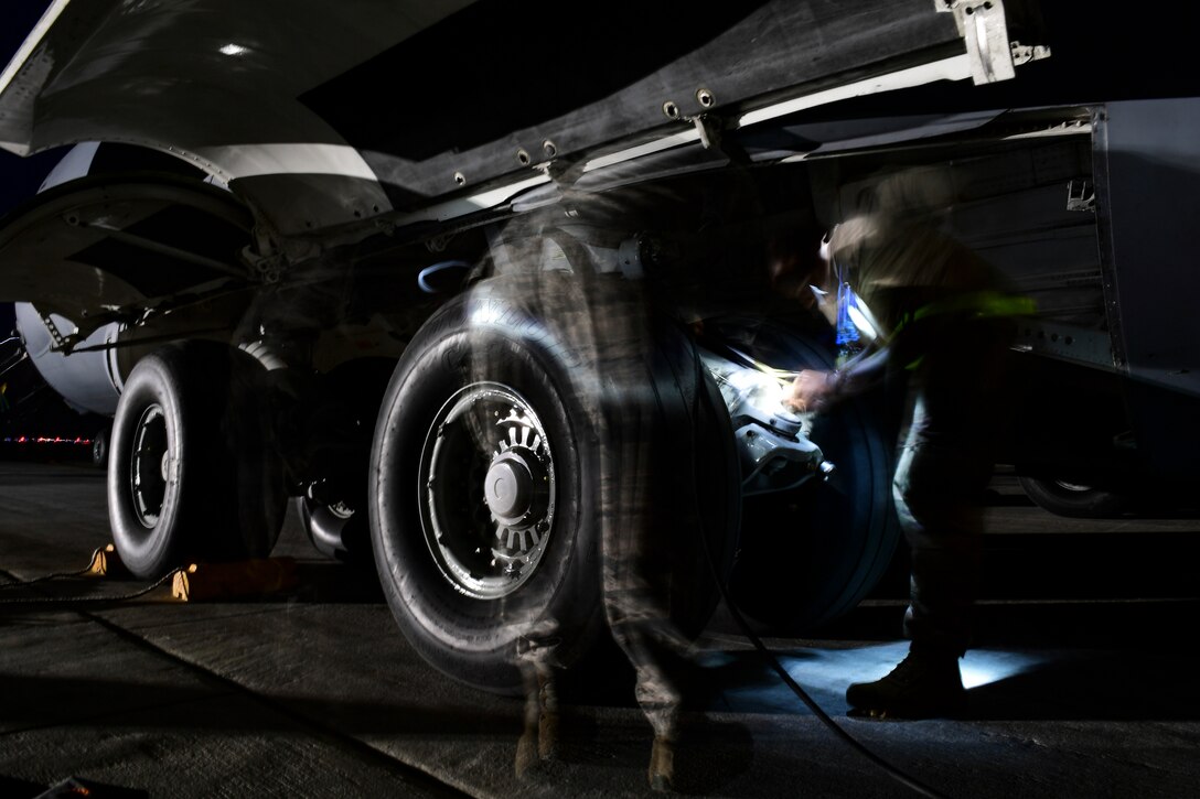 Crew chiefs assigned to the 911th Aircraft Maintenance Squadron prepare to raise a C-17 Globemaster III during a thru-flight inspection at the Pittsburgh International Airport Air Reserve Station, Pennsylvania, April 16, 2019.
