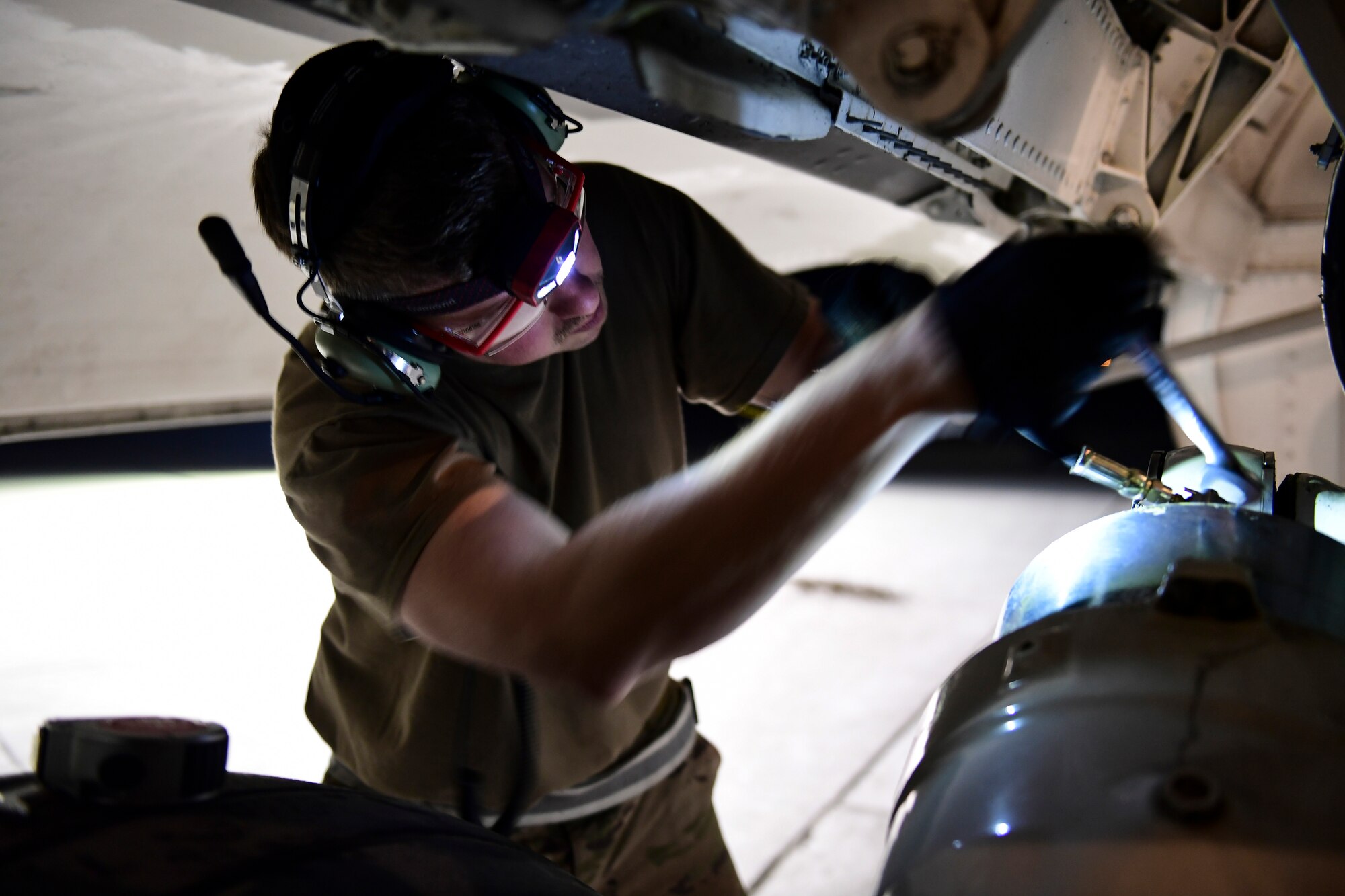 Tech Sgt. Jay Miller, crew chief with the 911th Aircraft Maintenance Squadron, prepares to raise a C-17 Globemaster III during a thru-flight inspection at the Pittsburgh International Airport Air Reserve Station, Pennsylvania, April 16, 2019.