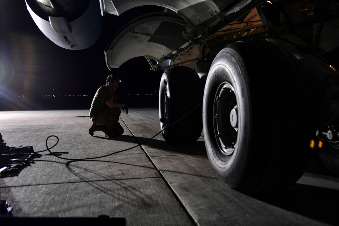 Tech. Sgt. Jay Miller, crew chief with the 911th Aircraft Maintenance Squadron, watches as a C-17 Globemaster III is raised during a thru-flight inspection at the Pittsburgh International Airport Air Reserve Station, Pennsylvania, April 16, 2019.