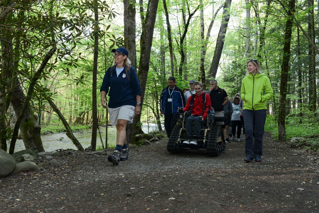 A group of people walking on a trail.