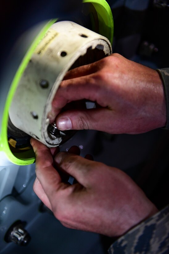 Staff Sgt. David Barbieri, crewchief with the 911th Aircraft Maintenance Squadron, tightens a bolt on a C-17 Globemaster III tire during a thru-flight inspection at the Pittsburgh International Airport Air Reserve Station, Pennsylvania, April 16, 2019.